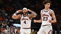 Illinois Fighting Illini guard Kylan Boswell (4) and guard Keaton Wagler (23) react in the second half against the Iowa Hawkeyes during an Elite Eight game of the South Regional of the men's 2026 NCAA Tournament at Toyota Center.