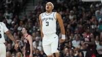 San Antonio Spurs forward Keldon Johnson (3) celebrates in the first half against the Chicago Bulls at Frost Bank Center.