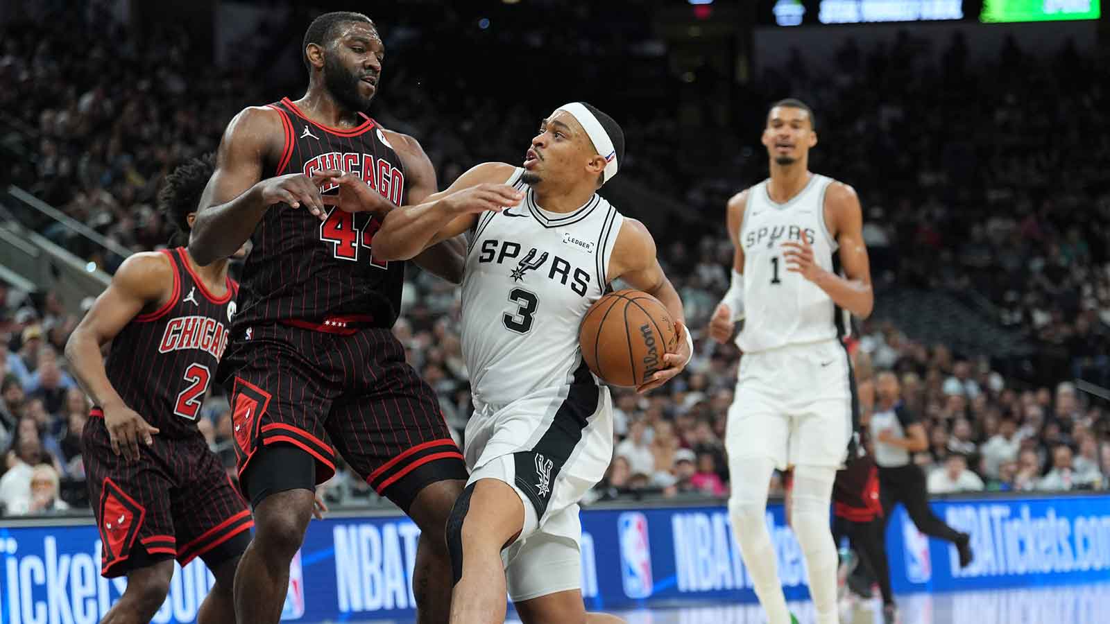 San Antonio Spurs forward Keldon Johnson (3) drives in against Chicago Bulls forward Patrick Williams (44) in the second half at Frost Bank Center.