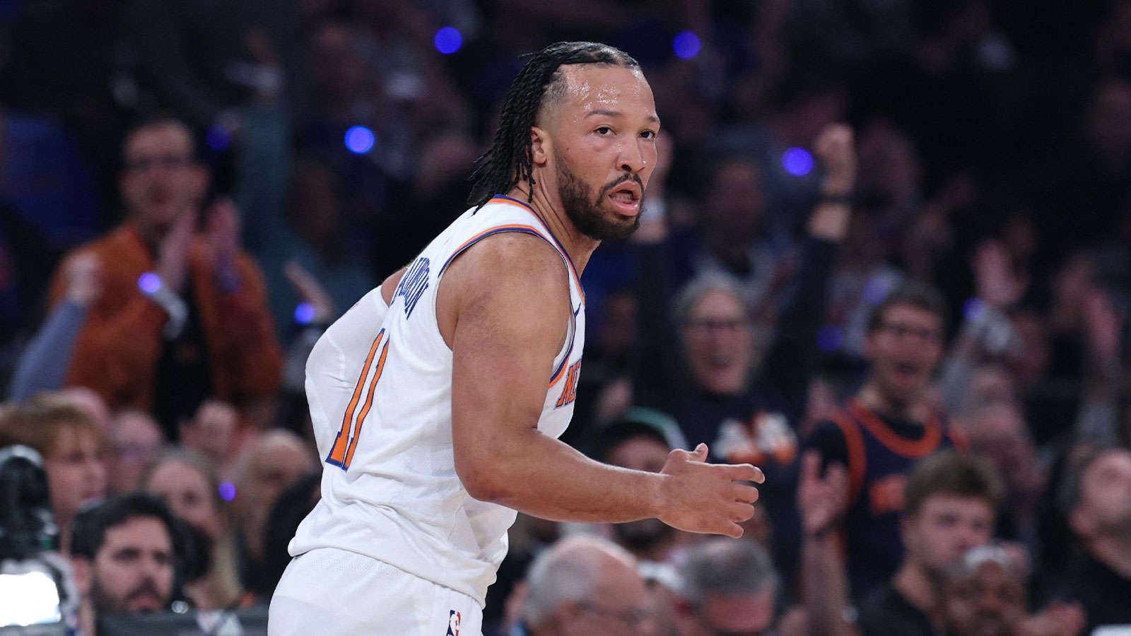 Knicks guard Jalen Brunson (11) looks to pass as Atlanta Hawks forward Jonathan Kuminga (0) defends during the first half of the 2026 NBA Playoffs at Madison Square Garden