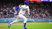 Los Angeles Dodgers right fielder Kyle Tucker (23) runs to first base with a single against the Cleveland Guardians during the first inning at Dodger Stadium.