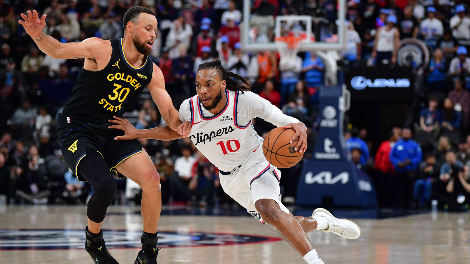 Los Angeles Clippers guard Darius Garland (10) moves to the basket against Golden State Warriors guard Stephen Curry (30) during the second half at Intuit Dome.