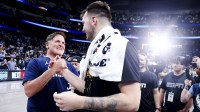 Lakers guard Luka Doncic (77) hugs Mark Cuban after the game against the Dallas Mavericks at American Airlines Center