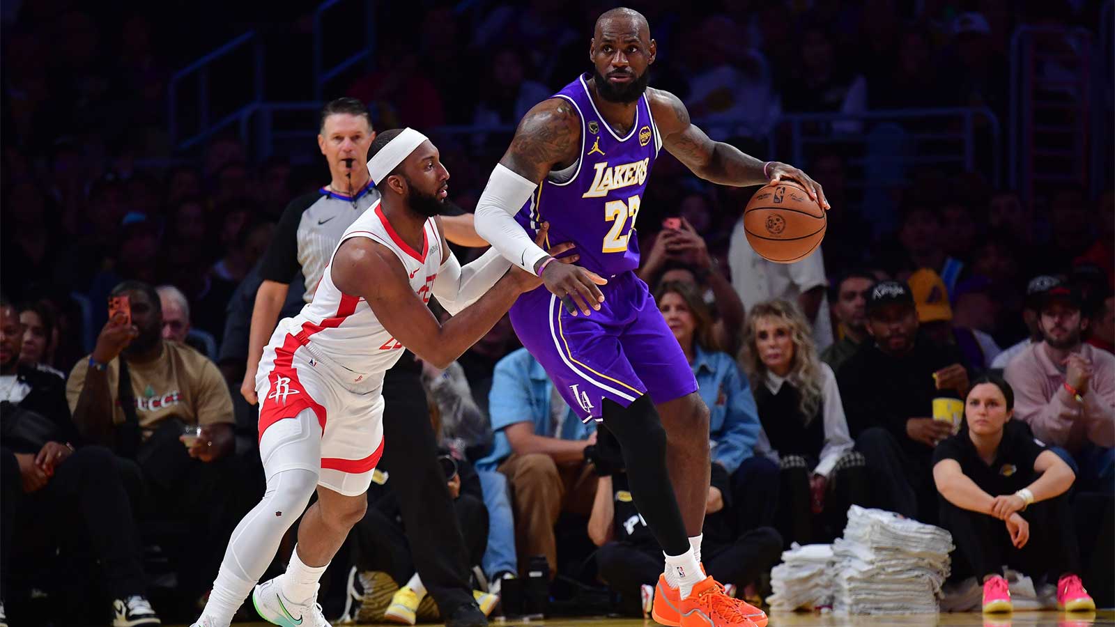 Lakers forward LeBron James (23) moves the ball against Houston Rockets guard Josh Okogie (20) during the second half in game five of the first round of the 2026 NBA Playoffs at Crypto.com Arena