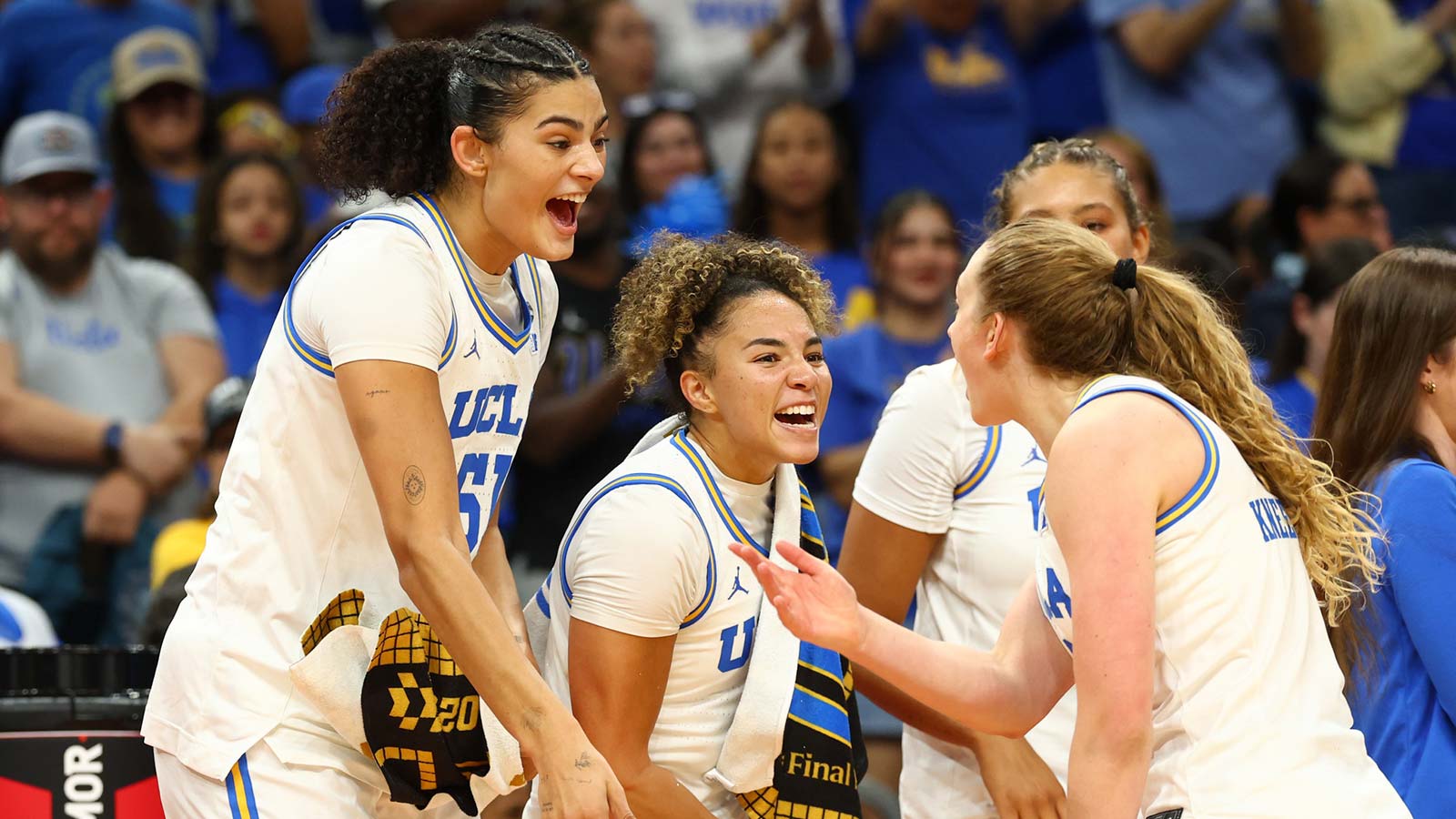 UCLA Bruins center Lauren Betts (51), guard Kiki Rice (1) and guard Gianna Kneepkens (8) celebrate in the fourth quarter against the South Carolina Gamecocks during the National Championship game of the women's 2026 NCAA Tournament at Mortgage Matchup Center.