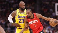 Houston Rockets forward Kevin Durant (7) dribbles the ball as Los Angeles Lakers forward LeBron James (23) defends during the first quarter at Toyota Center.