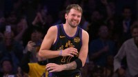Los Angeles Lakers guard Luka Doncic (77) smiles after a dunk in the final minutes of the game against the Cleveland Cavaliers at Crypto.com Arena.
