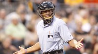 Home plate umpire C. B. Bucknor gestures in the game between the Houston Astros and the Pittsburgh Pirates during the fourth inning at PNC Park.