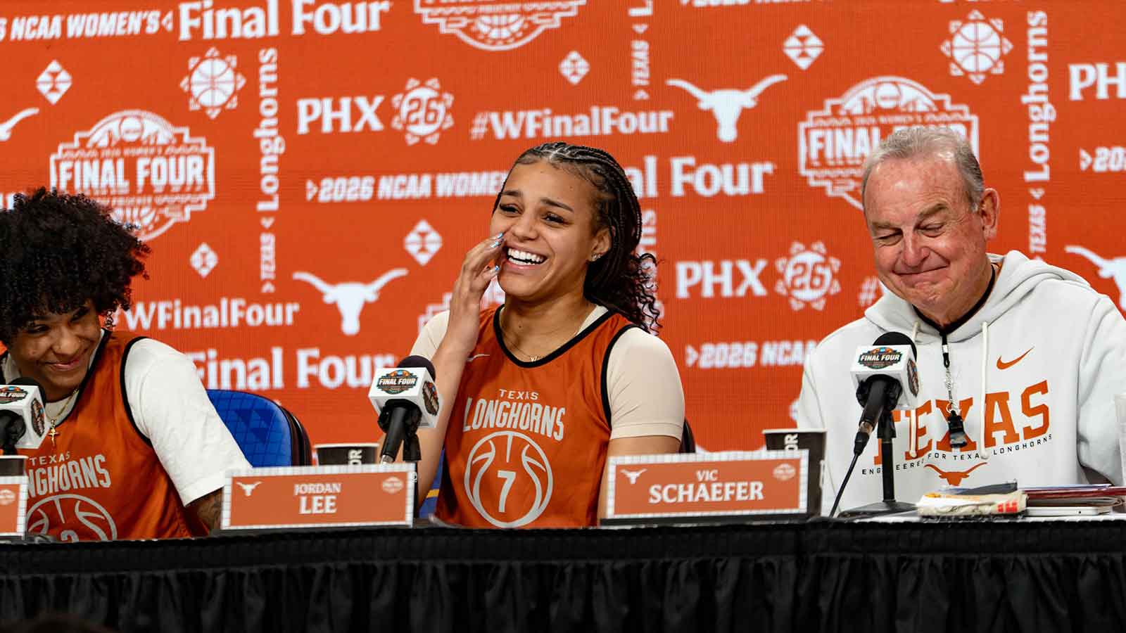 Texas Longhorns' Rori Harmon, Jordan Lee and head coach Vic Schaefer laugh as Madison Booker makes a joke during the NCAA Women's Final Four media day at Mortgage Matchup Center in Phoenix on April 2, 2026.
