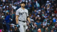 New York Yankees designated hitter Giancarlo Stanton (27) reacts following a strikeout against the Seattle Mariners during the second inning at T-Mobile Park. Mandatory Credit: Joe Nicholson-Imagn Images
