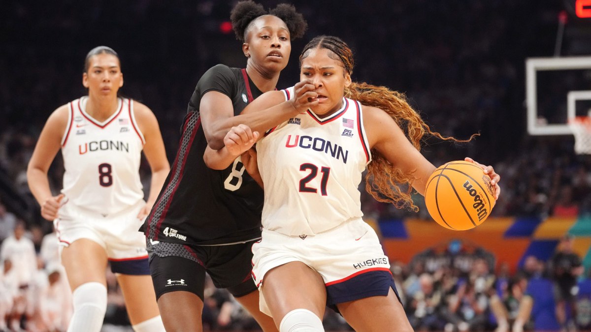 Connecticut Huskies forward Sarah Strong (21) drives in to the lane as South Carolina Gamecocks forward Joyce Edwards (8) defends during their NCAA Women's Final Four semifinal game.