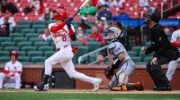 St. Louis Cardinals shortstop Masyn Winn (0) hits a walk-off one run single against the New York Mets during the eleventh inning at Busch Stadium.