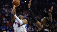 Philadelphia 76ers guard Tyrese Maxey (0) shoots over Detroit Pistons guard Daniss Jenkins (24) during the first half at Xfinity Mobile Arena.