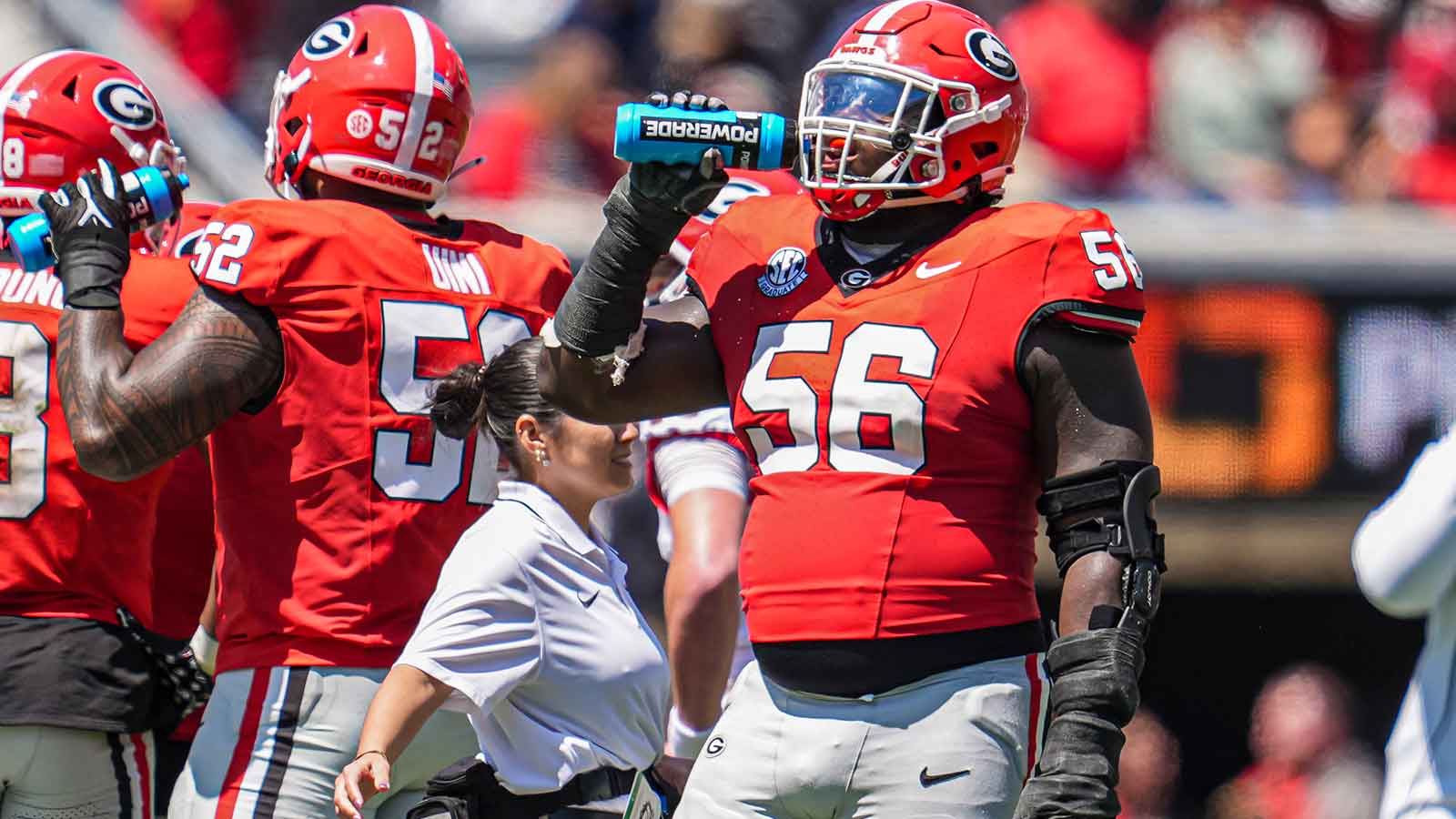 Georgia Bulldogs offensive lineman Micah Morris (56) takes a drink during the Georgia Spring game at Sanford Stadium.