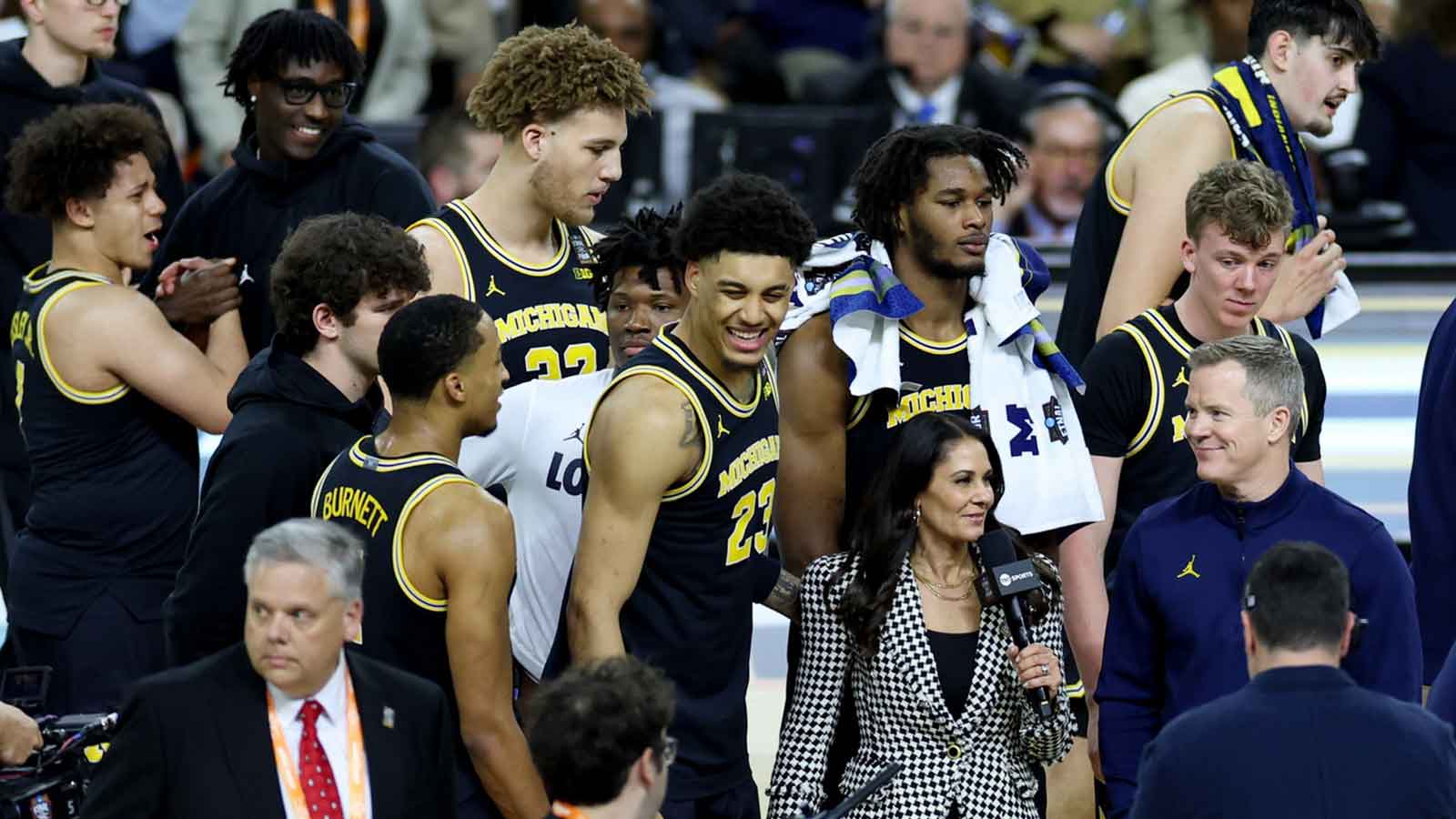 Michigan Wolverines forward Yaxel Lendeborg (23) and Michigan Wolverines head coach Dusty May are interviewed after the semifinal of the Final Four of the men's 2026 NCAA Tournament against the Arizona Wildcats at Lucas Oil Stadium.