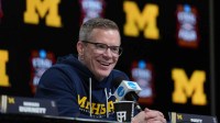 Michigan Wolverines head coach Dusty May during a press conference ahead of the Final Four of the men's 2026 NCAA Tournament at Lucas Oil Stadium.