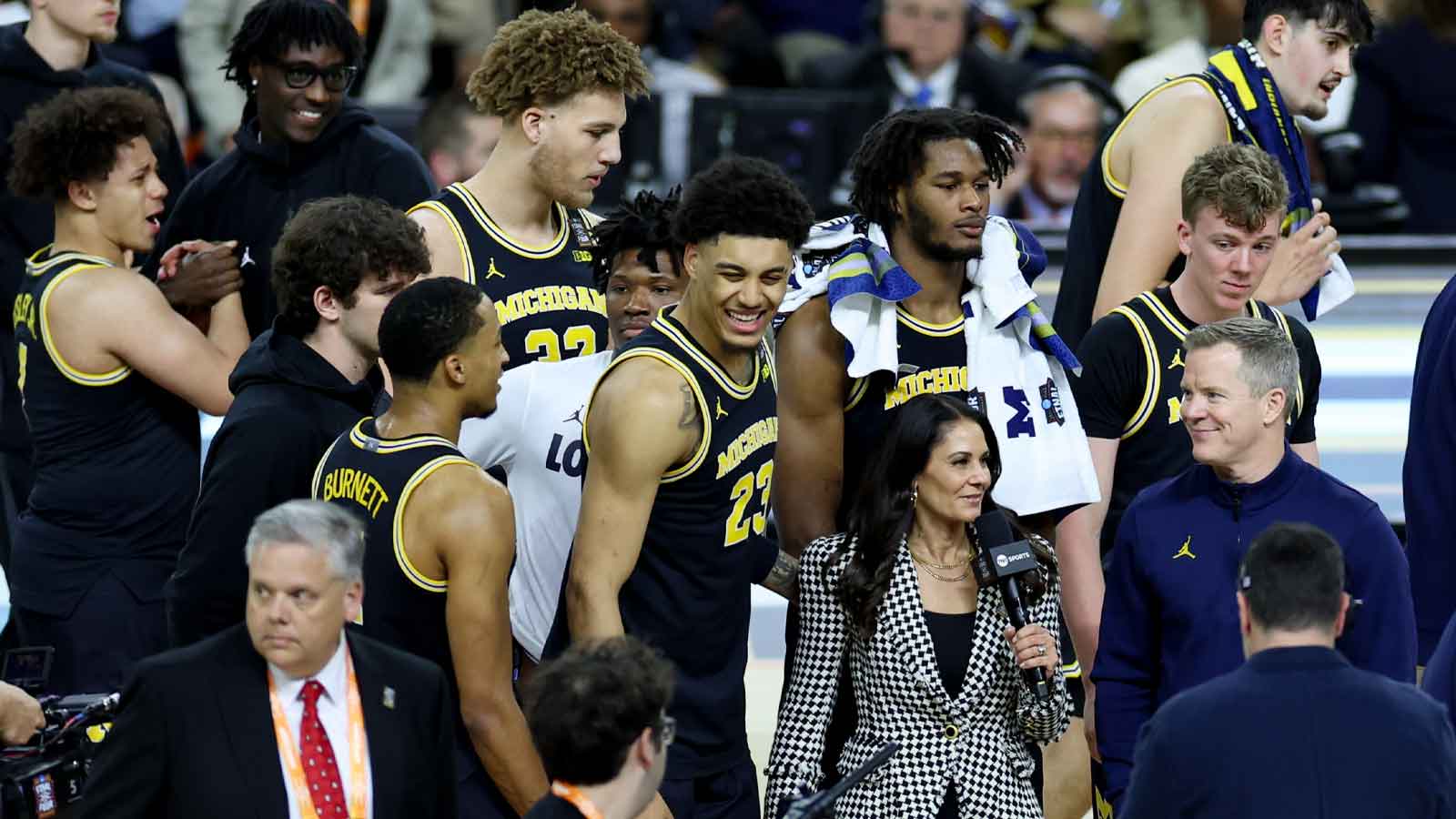 Michigan Wolverines forward Yaxel Lendeborg (23) and Michigan Wolverines head coach Dusty May are interviewed after the semifinal of the Final Four of the men's 2026 NCAA Tournament against the Arizona Wildcats at Lucas Oil Stadium.