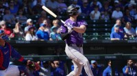 Colorado Rockies right fielder Mickey Moniak (22) hits a solo home run against the Chicago Cubs in the first inning at Sloan Park