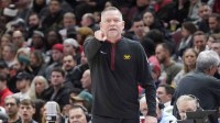 Denver Nuggets head coach Mike Malone gestures to his team in a game against the Chicago Bulls during the first half at United Center.