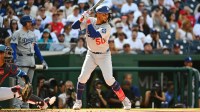 Los Angeles Dodgers shortstop Mookie Betts (50) at bat against the Washington Nationals during the first inning at Nationals Park.