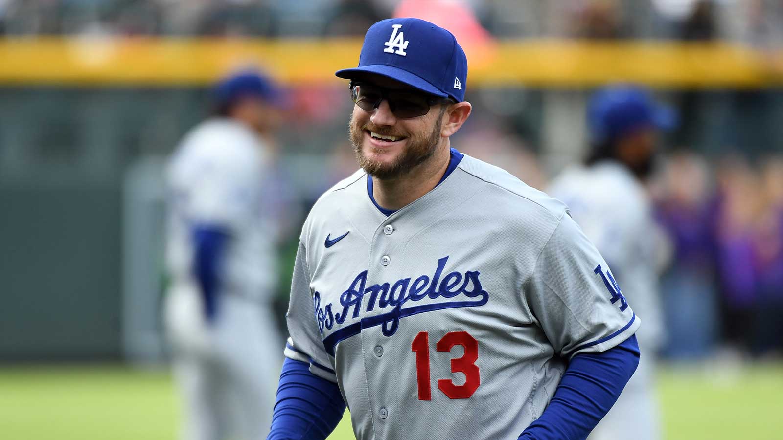 Los Angeles Dodgers infielder Max Muncy (13) warms up before the game against the Colorado Rockies at Coors Field.