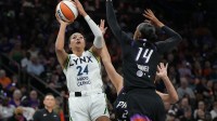 Minnesota Lynx forward Napheesa Collier (24) shoots over Phoenix Mercury forward DeWanna Bonner (14) during game three of the second round for the 2025 WNBA Playoffs at PHX Arena.