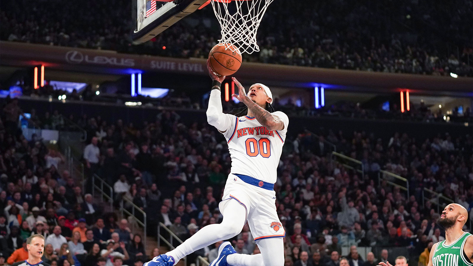 New York Knicks guard Jordan Clarkson (0) sores a layup against the Boston Celtics during the first half at Madison Square Garden.