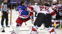 New York Rangers goaltender Igor Shesterkin (31) and New Jersey Devils goaltender Jacob Markstrom (25) fight in the third period at Madison Square Garden
