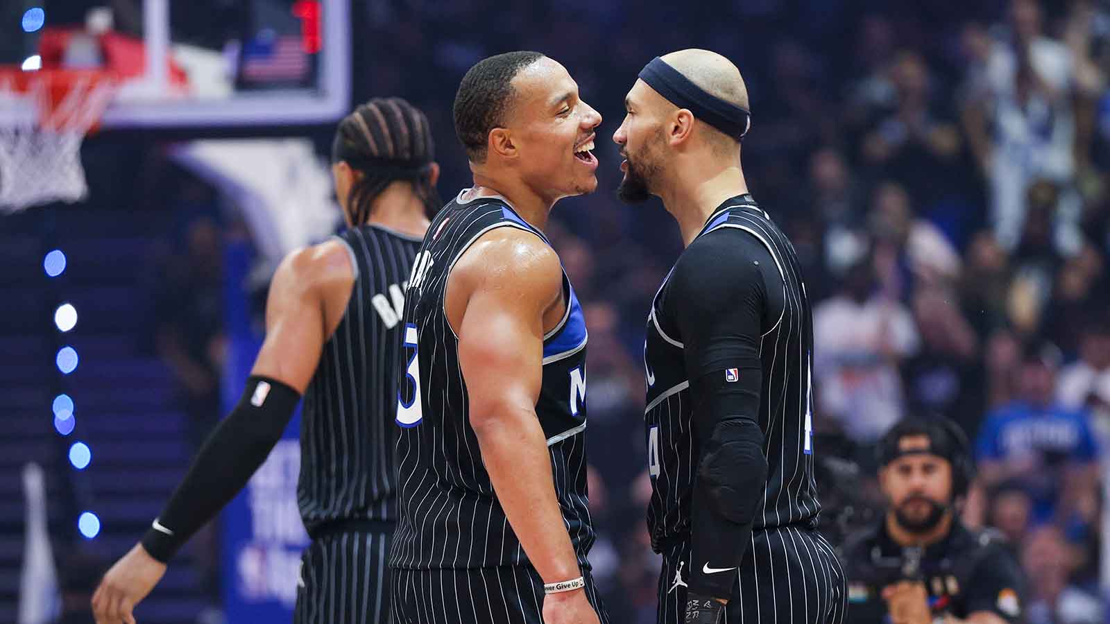 Orlando Magic guard Desmond Bane (3) and guard Jalen Suggs (4) react after a play against the Detroit Pistons in the second quarter during game three of the first round of the 2026 NBA Playoffs at Kia Center.