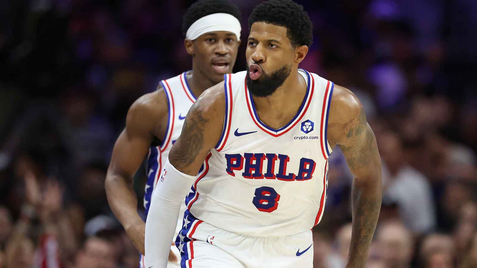 Philadelphia 76ers forward Paul George (8) reacts to his score against the Boston Celtics during the second quarter at Xfinity Mobile Arena.