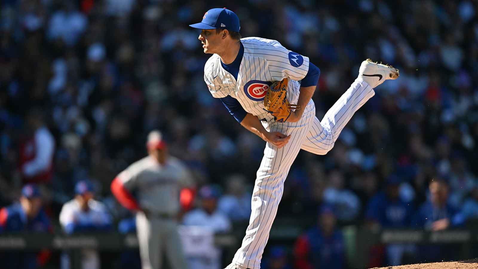 Cubs place pitcher on IL, DFA outfielder