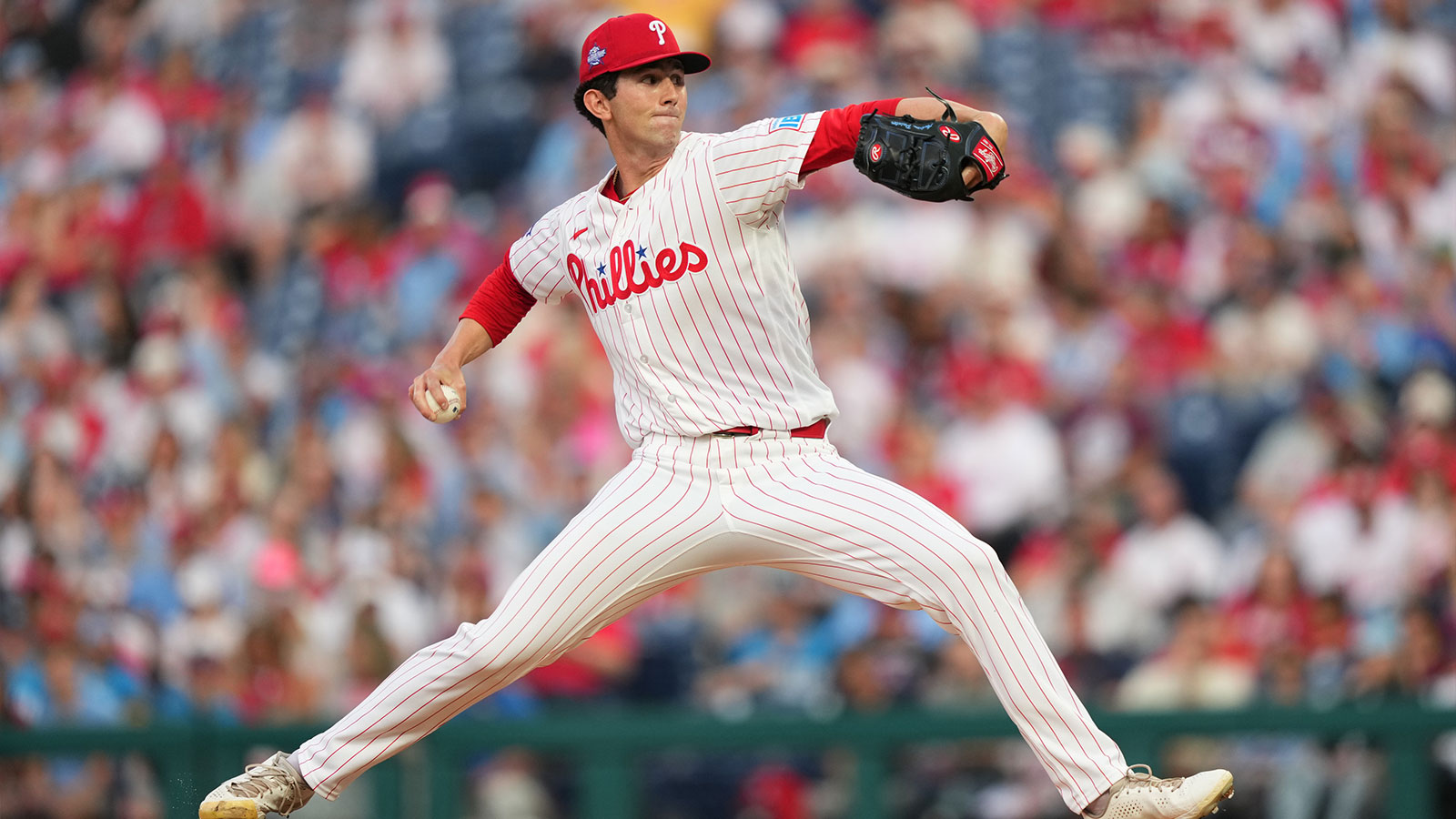 Philadelphia Phillies starting pitcher Andrew Painter (24) throws a pitch against the Washington Nationals in the first inning at Citizens Bank Park.