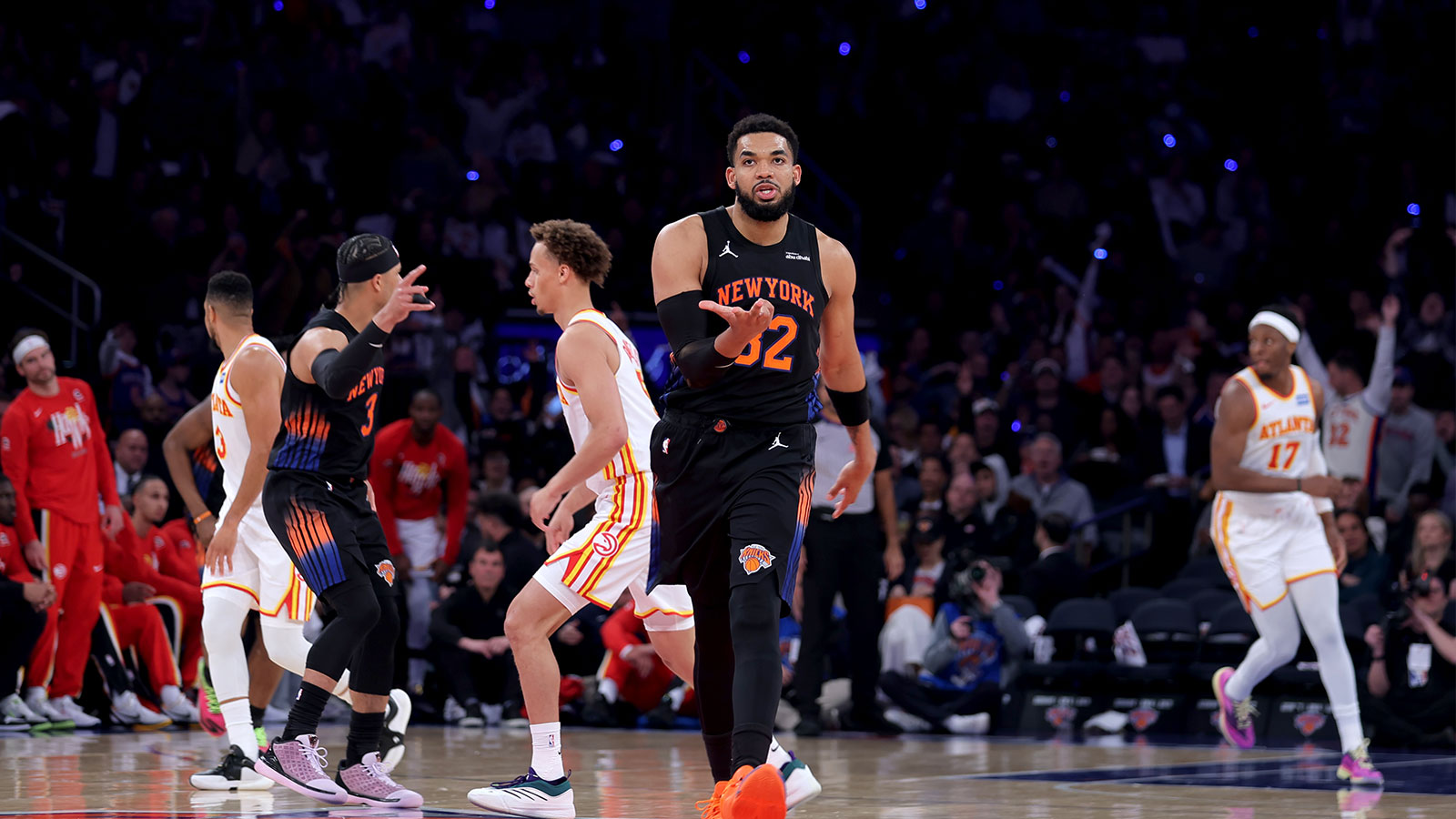 New York Knicks center Karl-Anthony Towns (32) celebrates his three point shot against the Atlanta Hawks during the third quarter of game two of the first round of the 2026 NBA Playoffs at Madison Square Garden.