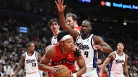 Toronto Raptors forward Scottie Barnes (4) looks for a way past Sacramento Kings forward Precious Achiuwa (9) in the second half at Scotiabank Arena.