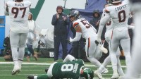 The Denver defense celebrate a sack of Aaron Rodgers of the Jets in the fourth quarter as the Denver Broncos edged the New York Jets 10-9 at MetLife Stadium.