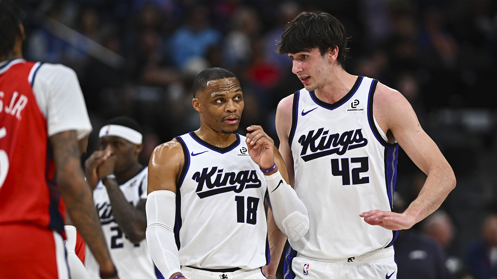 Sacramento Kings center Maxime Raynaud (42) talks to guard Russell Westbrook (18) against the LA Clippers during the first quarter at Intuit Dome.