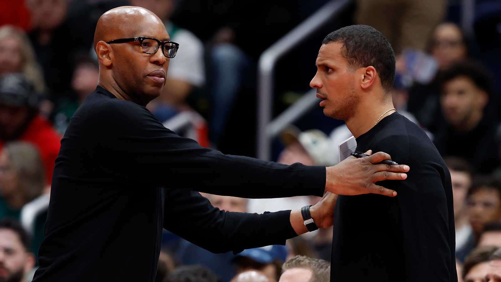 Boston Celtics head coach Joe Mazzulla is restrained by assistant coach Sam Cassell (L) after being assessed a technical foul against the Washington Wizards in the second half at Capital One Arena.