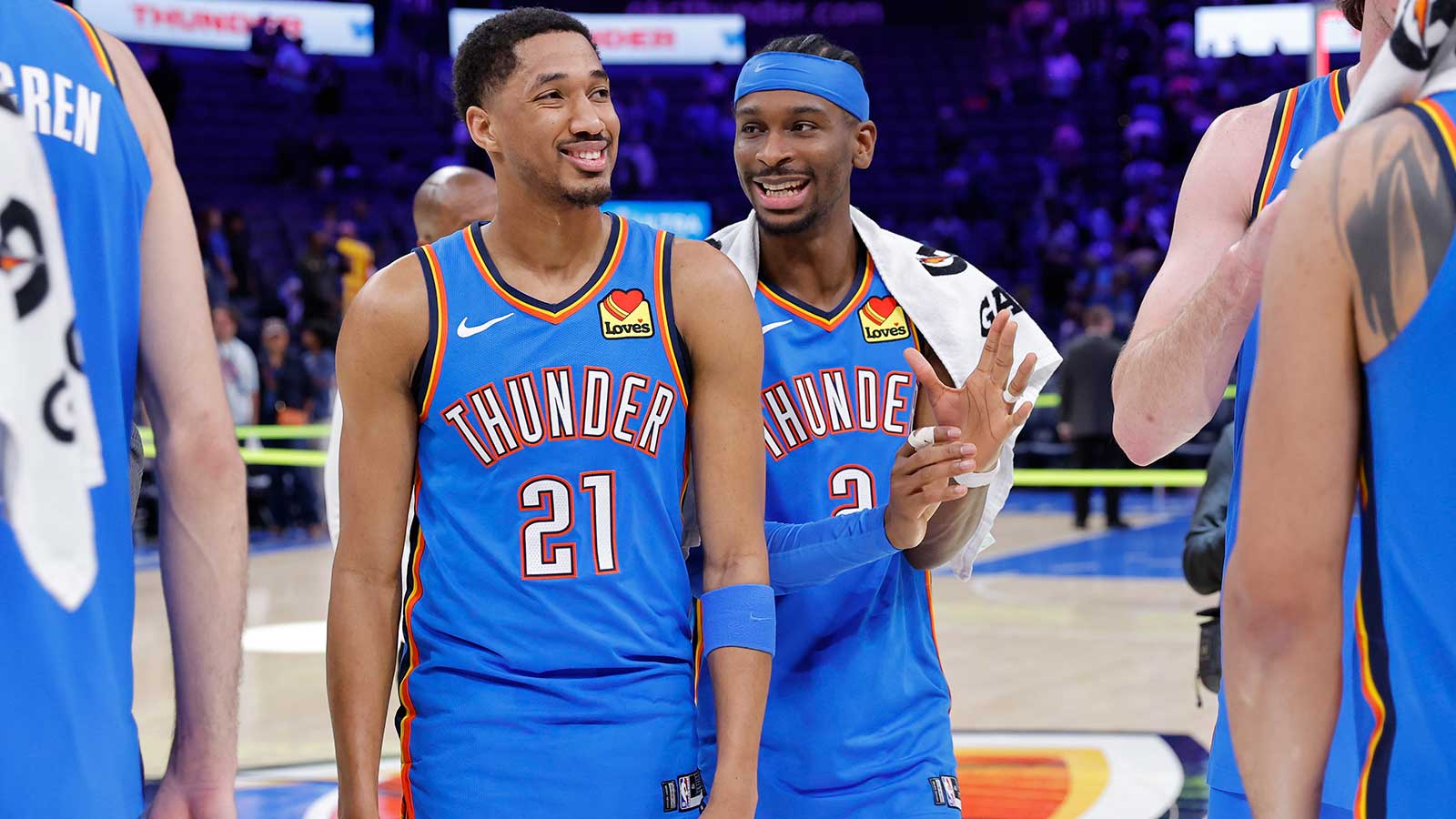 Oklahoma City Thunder guard Aaron Wiggins (21) and Oklahoma City Thunder guard Shai Gilgeous-Alexander (2) laugh after a game against the Utah Jazz at Paycom Center. 