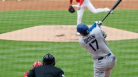 Los Angeles Dodgers two-way player Shohei Ohtani (17) hits a solo home run off of Washington Nationals pitcher Foster Griffin (22) during the third inning at Nationals Park