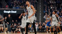 San Antonio Spurs center Victor Wembanyama (1) reacts after the Spurs made a three point basket against the Golden State Warriors in the first quarter at the Chase Center.