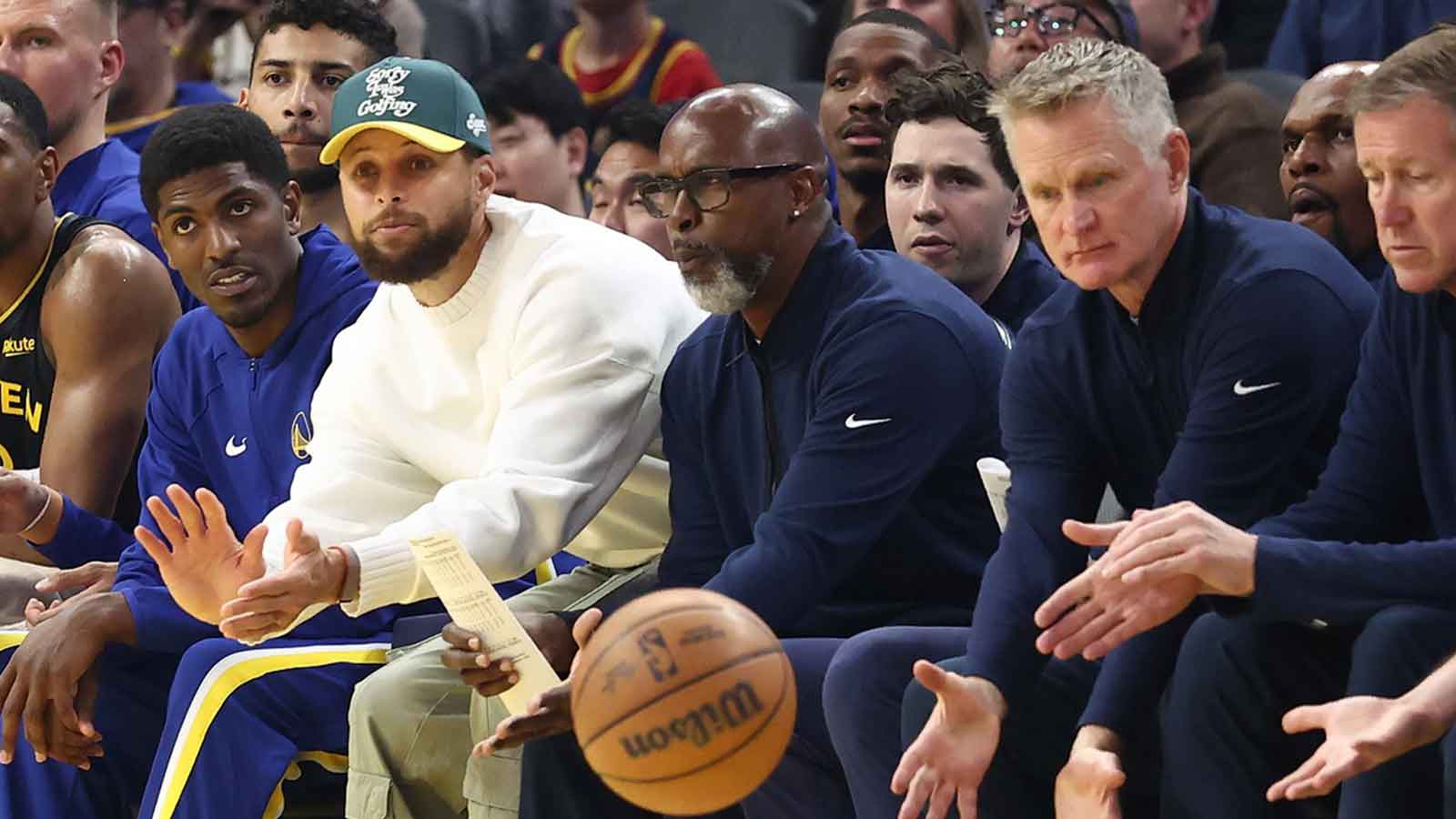 Golden State Warriors guard Stephen Curry (left) gestures for the ball as it goes out of bounds towards head coach Steve Kerr (right) during the second quarter against the Cleveland Cavaliers at Chase Center.