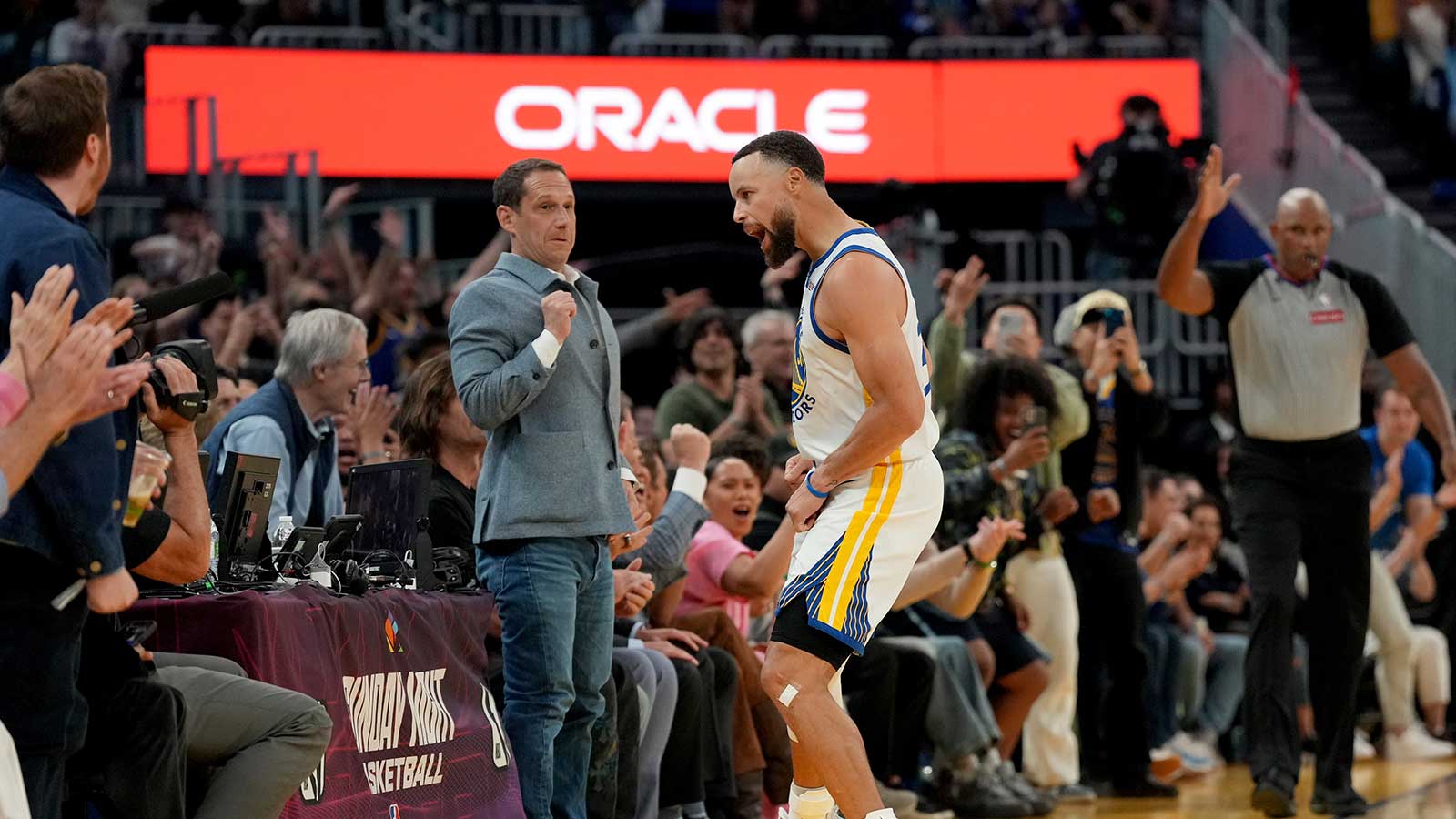 Golden State Warriors guard Stephen Curry (30) reacts after making a three point basket against the Houston Rockets in the third quarter at the Chase Center.