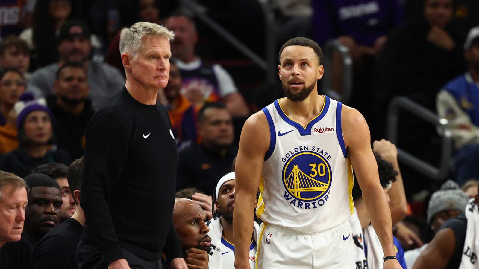 Golden State Warriors guard Stephen Curry (30) reacts alongside head coach Steve Kerr against the Phoenix Suns in the second half at Mortgage Matchup Center.