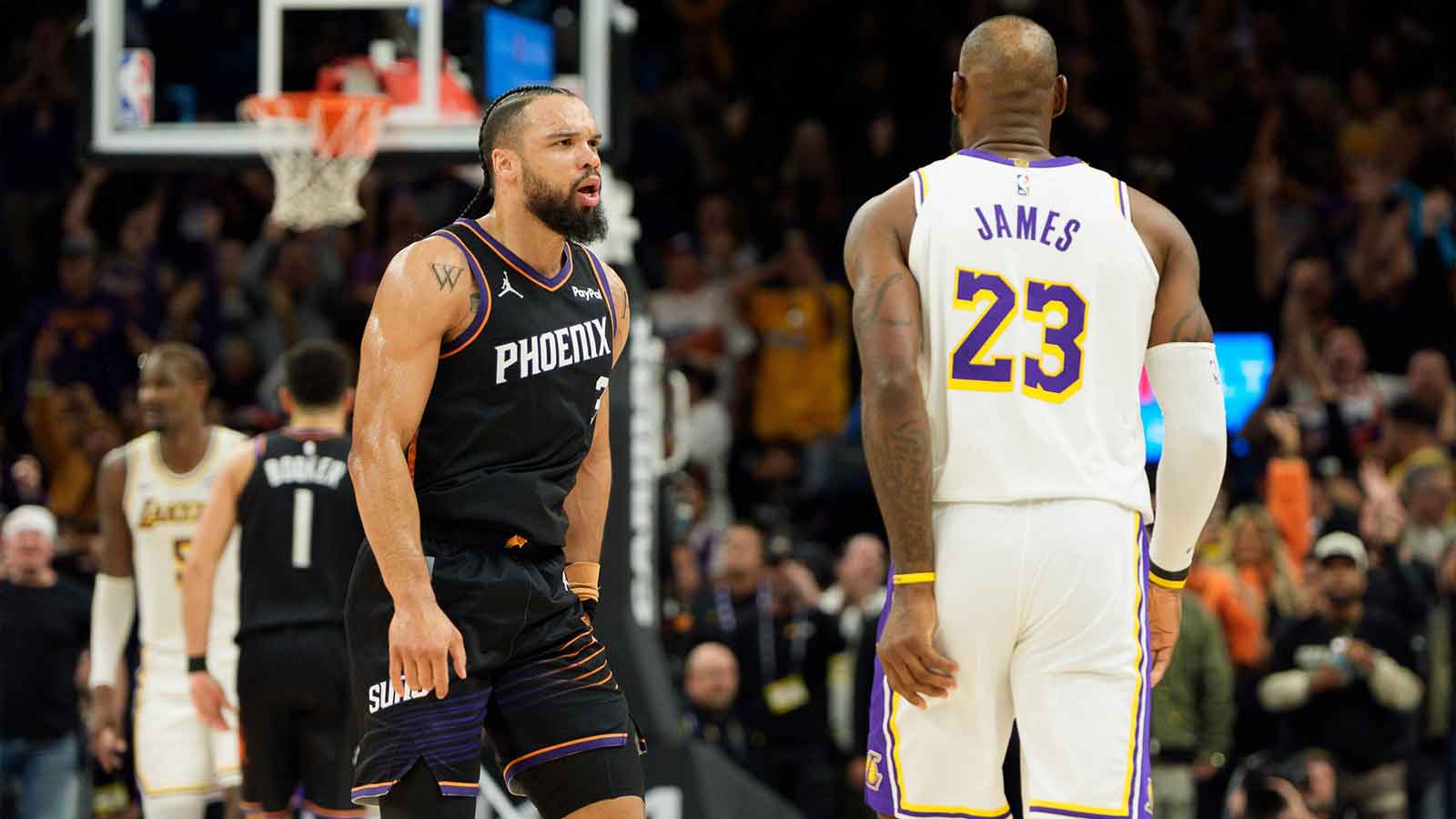 Phoenix Suns forward Dillon Brooks (3) and Los Angeles Lakers forward LeBron James (23) react during an altercation that resulted in a technical for Brooks during the second half of a game at at Mortgage Matchup Center.