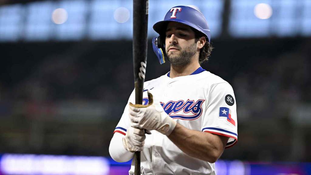 Texas Rangers shortstop Josh Smith (8) walks to the on deck circle during the first inning against the Minnesota Twins at Globe Life Field.