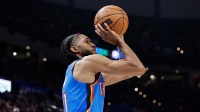 Thunder guard Isaiah Joe (11) lines up a three point basket against the Los Angeles Lakers during the second half at Paycom Center with Thunder head coach Mark Daigneault in the background