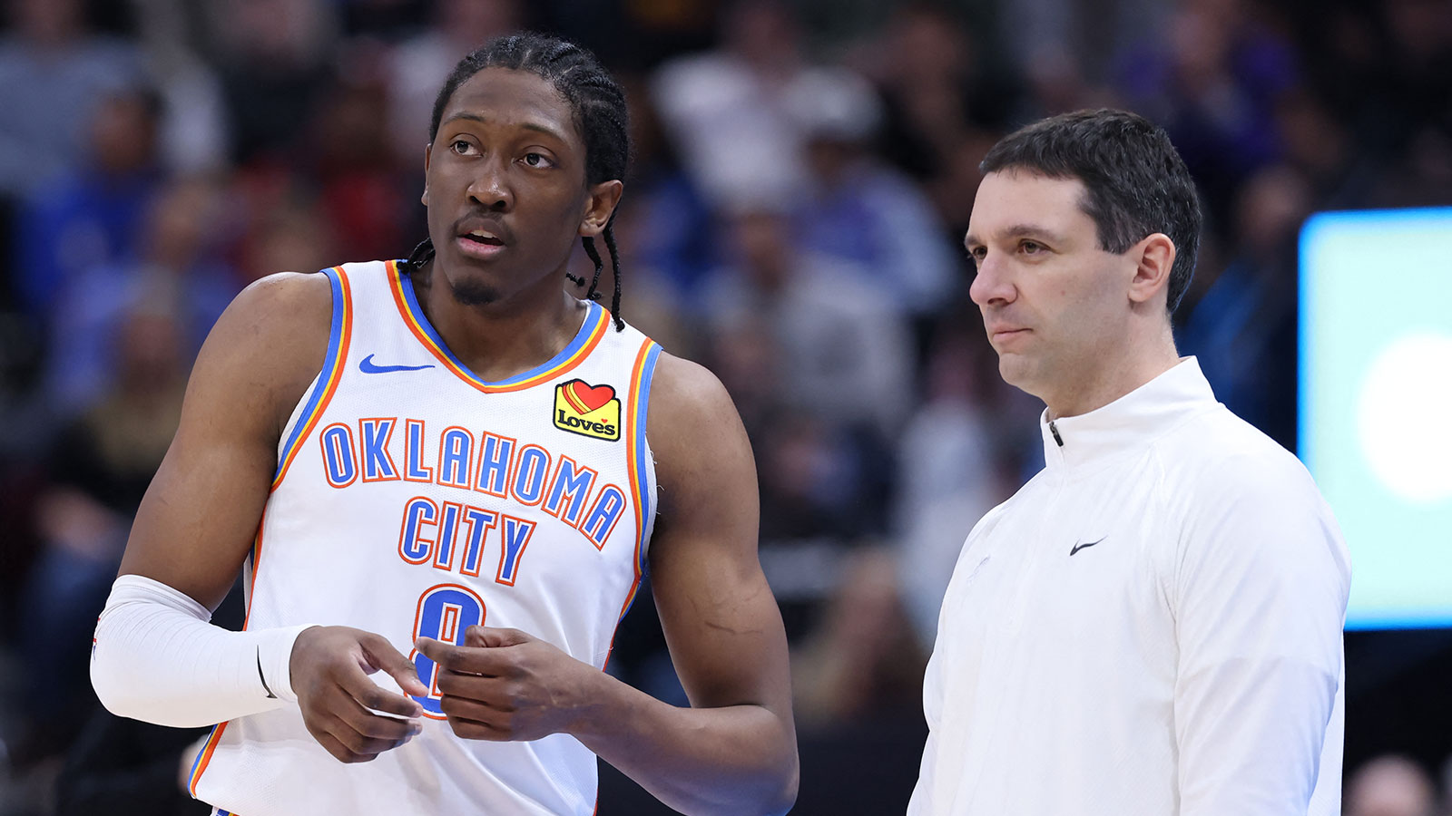 Thunder forward Jalen Williams (8) speaks with head coach Mark Daigneault during the second quarter at Delta Center