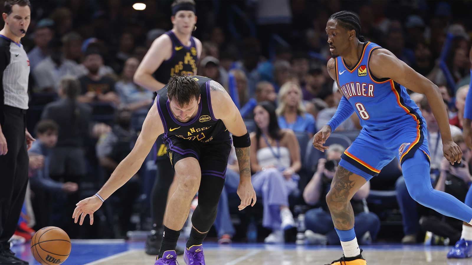 Lakers guard Luka Doncic (77) looses the ball during a drive against Oklahoma City Thunder guard Jalen Williams (8) during the second half at Paycom Center