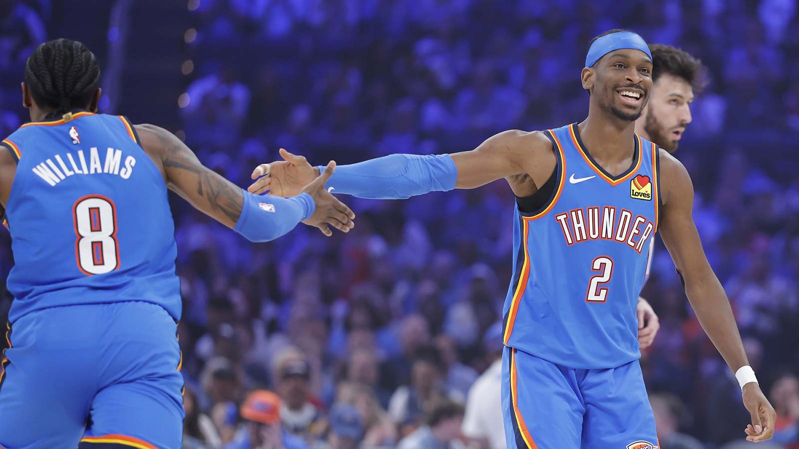 Thunder guard Shai Gilgeous-Alexander (2) celebrates with Oklahoma City Thunder guard Jalen Williams (8) after scoring against the Utah Jazz during the first quarter at Paycom Center