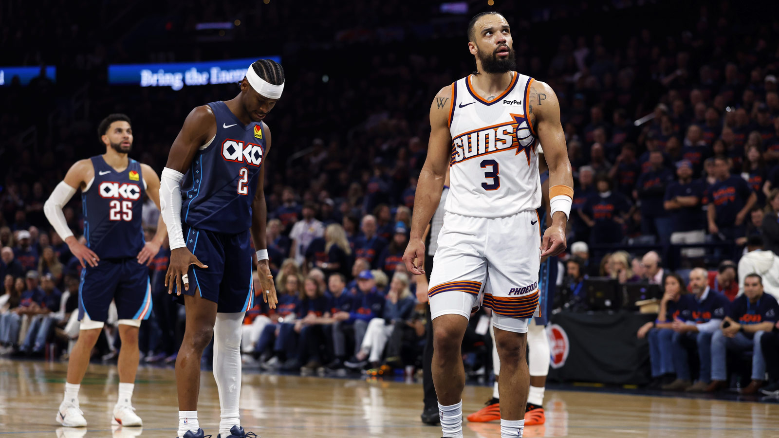 Suns forward Dillon Brooks (3) walks past Oklahoma City Thunder guard Shai Gilgeous-Alexander (2) in the second half during game two of the first round of the 2026 NBA Playoffs at Paycom Center